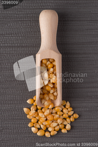 Image of Wooden scoop with corn