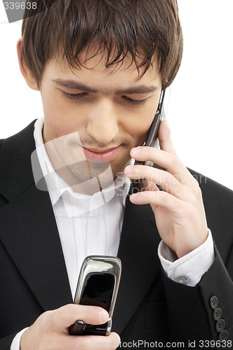 Image of businessman with two cellular phones