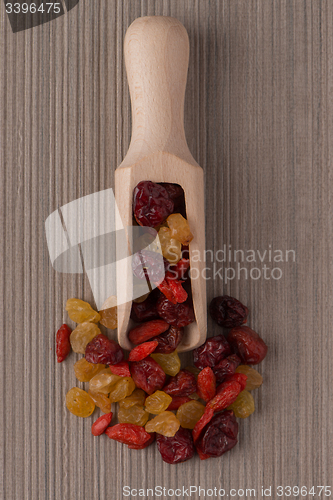 Image of Wooden scoop with mixed dried fruits