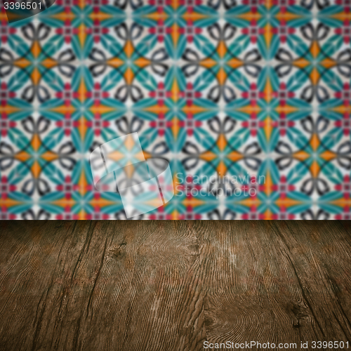 Image of Wood table top and blur vintage ceramic tile pattern wall