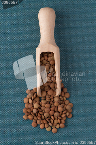 Image of Wooden scoop with lentils