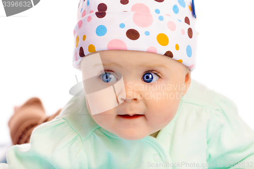 Image of Beautiful baby in the cap. Close-up. Studio photo