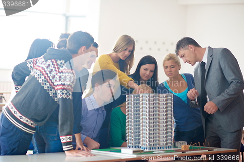 Image of group of students with teacher on class