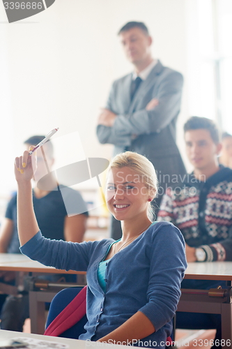 Image of group of students with teacher on class