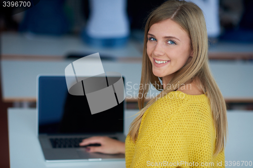 Image of portrait of happy smilling student girl at tech classroom