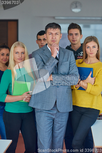 Image of group portrait of teacher with students