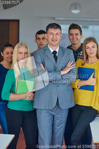 Image of group portrait of teacher with students