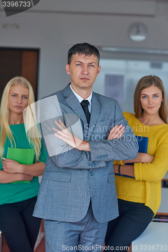 Image of group portrait of teacher with students
