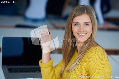 Image of portrait of happy smilling student girl at tech classroom