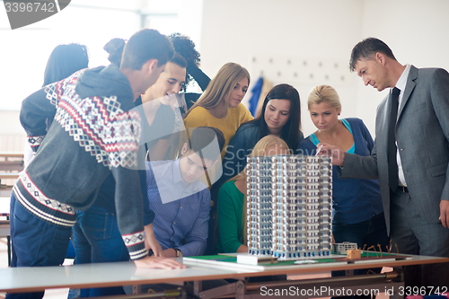 Image of group of students with teacher on class