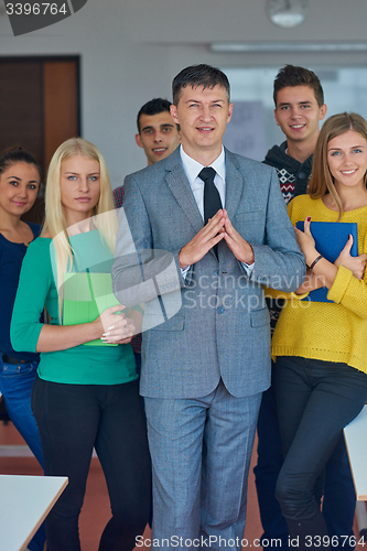 Image of group portrait of teacher with students