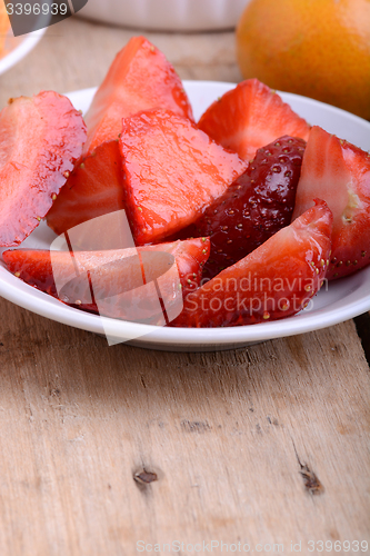 Image of Chopped strawberry in a white bowl
