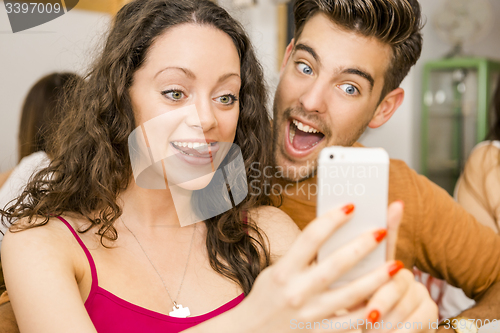 Image of Happy couple making a selfie