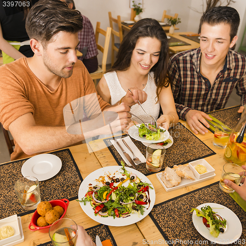 Image of Friends lunching at the restaurant