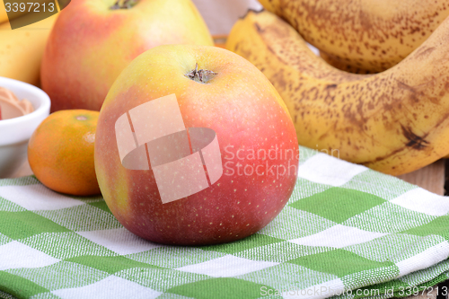 Image of mandarin, bananas and apples, fresh food close up