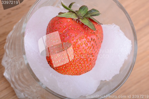 Image of strawberry frozen in ice cube, health food concept