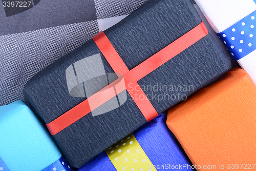 Image of bright gifts with ribbons, holiday invitation card