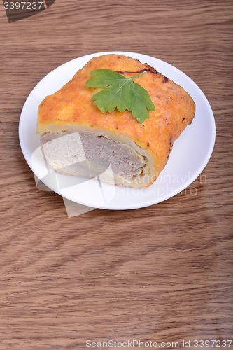 Image of fresh beef meat fillet with raw kale leafs on white plate