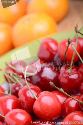 Image of Mandarins with Red Packets and Plum flowers on red background