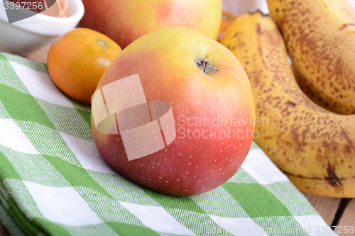 Image of mandarin, bananas and apples, fresh food close up