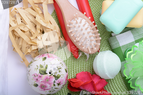 Image of Spa still life with aromatic candles, sea salt, stones, hair brush, flower and towel Relax and treatment therapy. Summer season. 