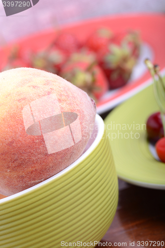 Image of fresh fruits and berries mixed collection surface close up, summer health food, peach, cherry, strawberry.