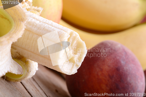 Image of fruits on table, apple, bananas, peach close up, health food concept