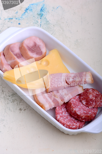 Image of toasted white bread with salami and cheese