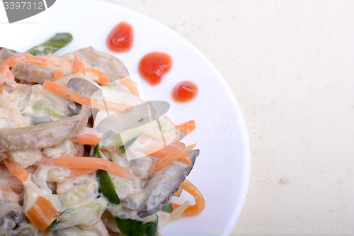 Image of mushroom salad with champignon and fresh carrots