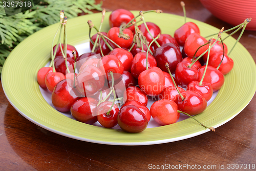 Image of Cherries on green table close up 