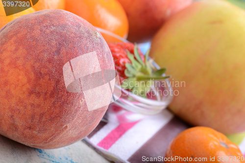 Image of many different fruits for the health of the entire family, peach, mandarin, orange, banana