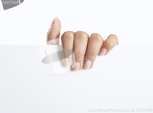 Image of Hand holding sign