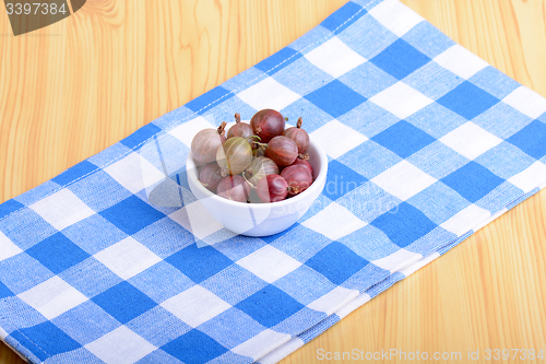 Image of Green gooseberries on white plate