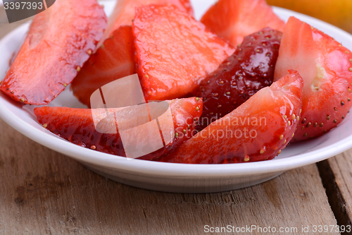 Image of Chopped strawberry in a white bowl