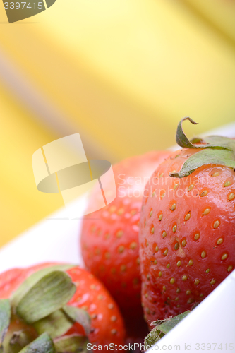 Image of composition of banana and strawberry close up