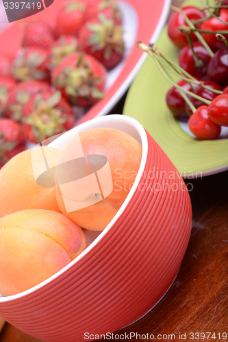 Image of Fresh berries background: apricots, cherries, strawberry