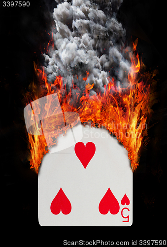 Image of Playing card with fire and smoke