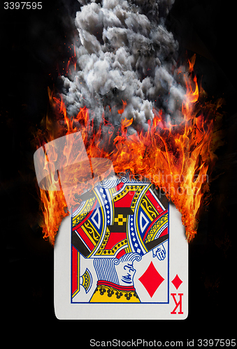 Image of Playing card with fire and smoke