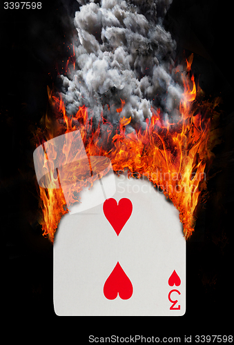 Image of Playing card with fire and smoke