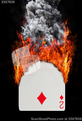 Image of Playing card with fire and smoke