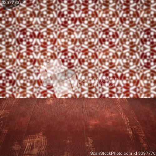 Image of Wood table top and blur vintage ceramic tile pattern wall