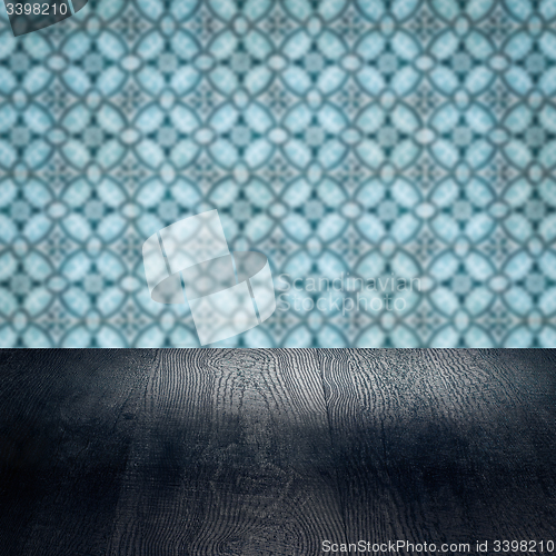 Image of Wood table top and blur vintage ceramic tile pattern wall