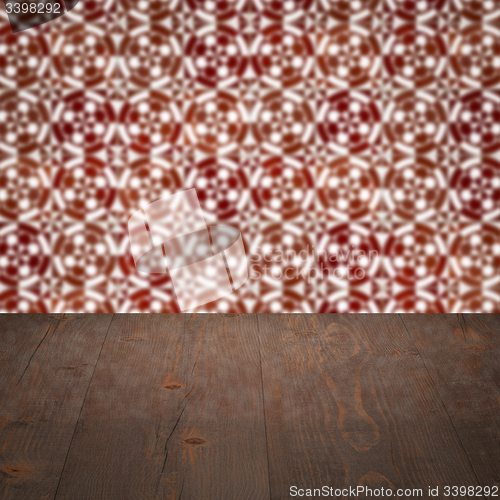 Image of Wood table top and blur vintage ceramic tile pattern wall