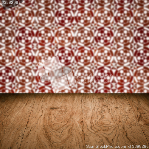 Image of Wood table top and blur vintage ceramic tile pattern wall