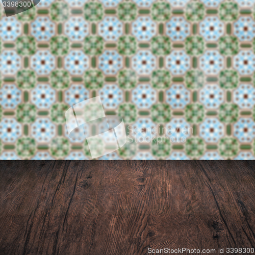 Image of Wood table top and blur vintage ceramic tile pattern wall