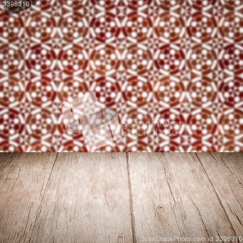 Image of Wood table top and blur vintage ceramic tile pattern wall
