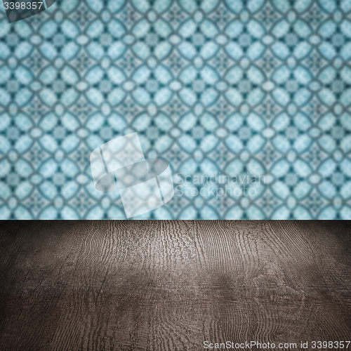 Image of Wood table top and blur vintage ceramic tile pattern wall