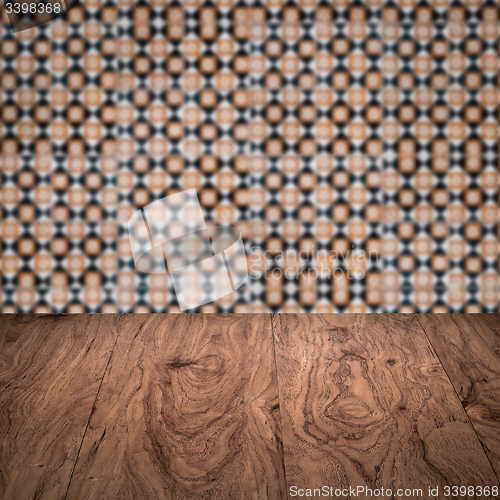 Image of Wood table top and blur vintage ceramic tile pattern wall