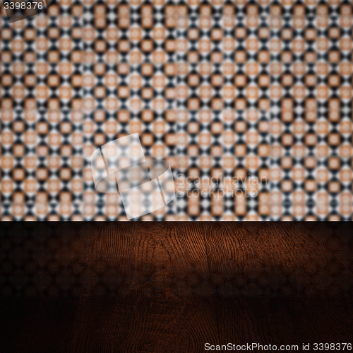 Image of Wood table top and blur vintage ceramic tile pattern wall