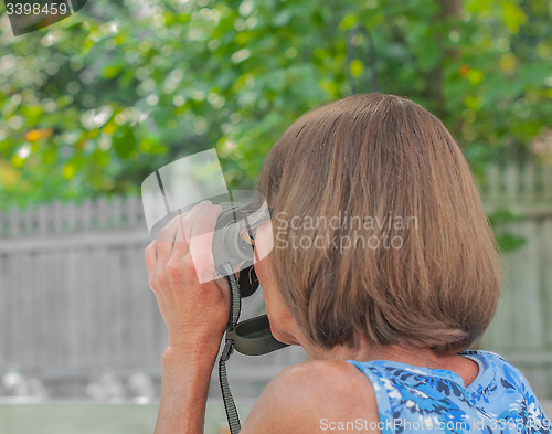 Image of Lady With Binoculars